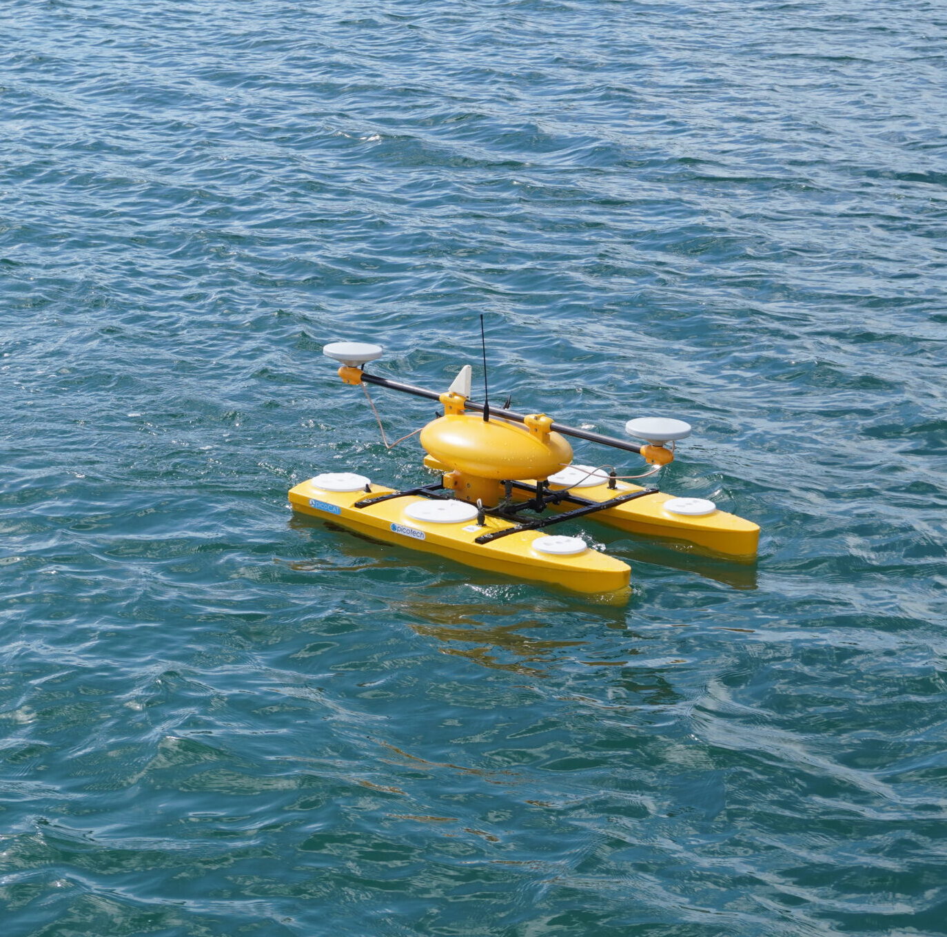 Yellow remotely operated boat in the sea.